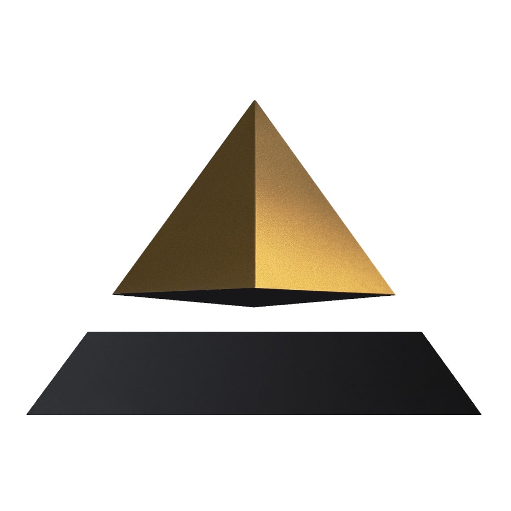 Levitating pyramid Py by Flyte, gold top on a black base, product photo on a white background