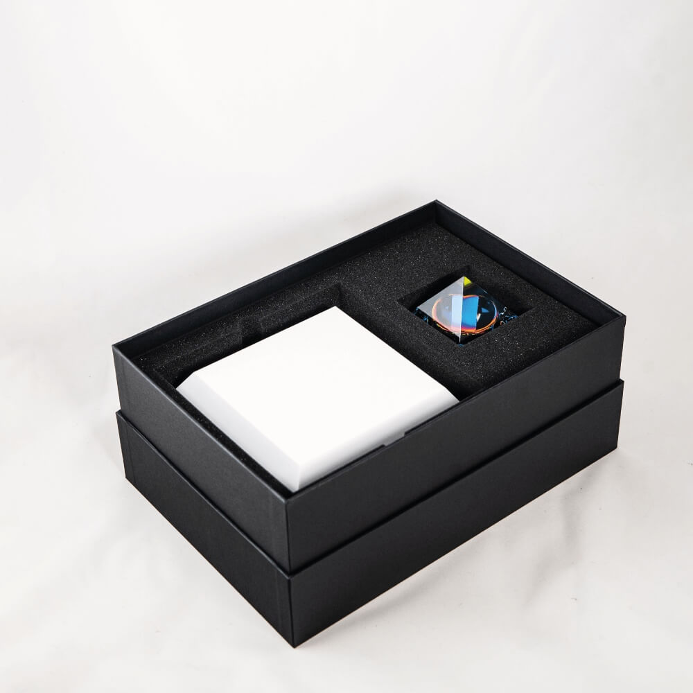 Levitating pyramid Py by Flyte, top view of open packaging on a white background