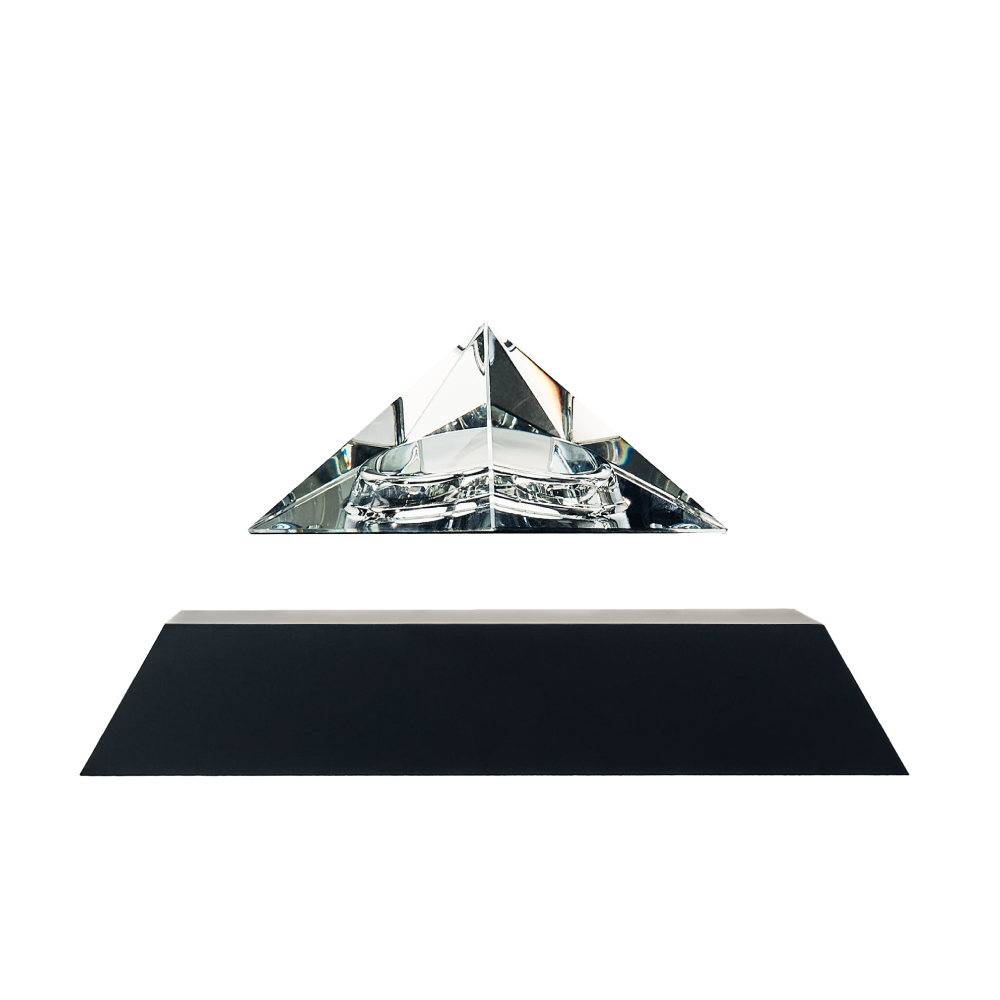 Levitating pyramid Py by Flyte, clear crystal glass with black base, product photo on a white background
