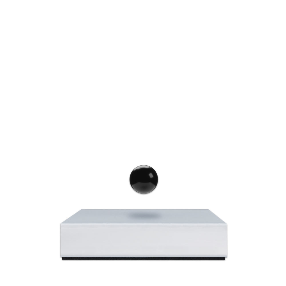 Product photo of levitating sphere Buda Ball made by Flyte, black sphere and white base option,