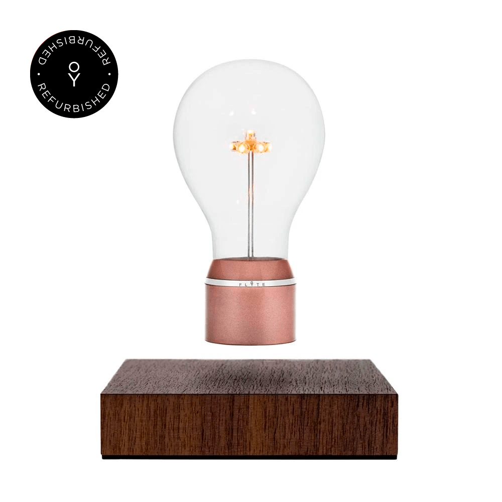 Levitating light bulb Light Edison by Flyte, product photo of copper cap bulb and walnut magnetic base version with refurbished tag