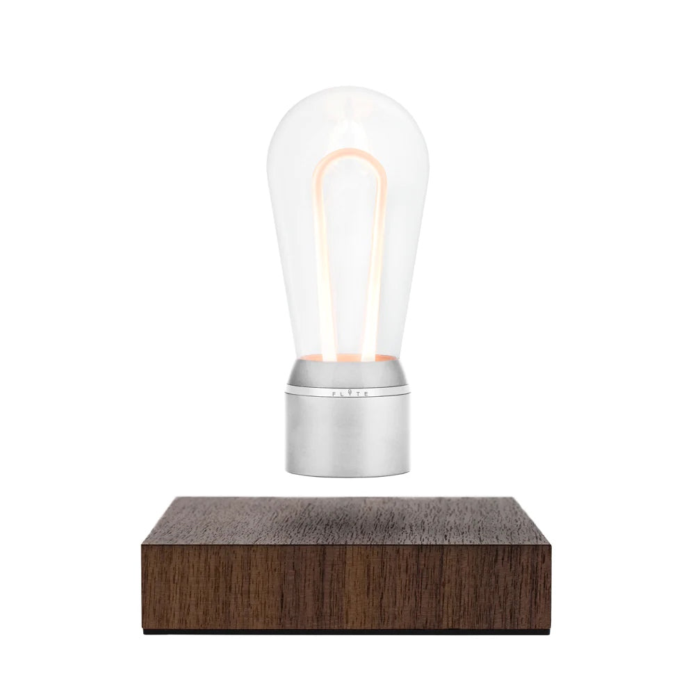 Levitating light bulb Light Marconi by Flyte, chrome cap and walnut base, product photo on a white background