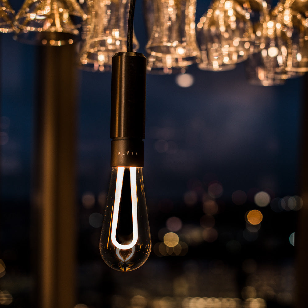 Arc LED light bulb hanging in restaurant