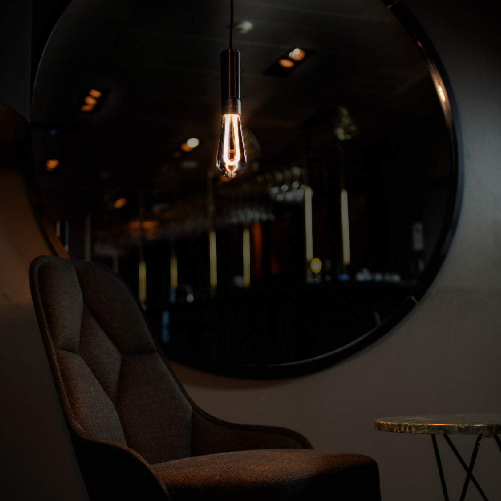 Arc LED light bulb hanging in cafe