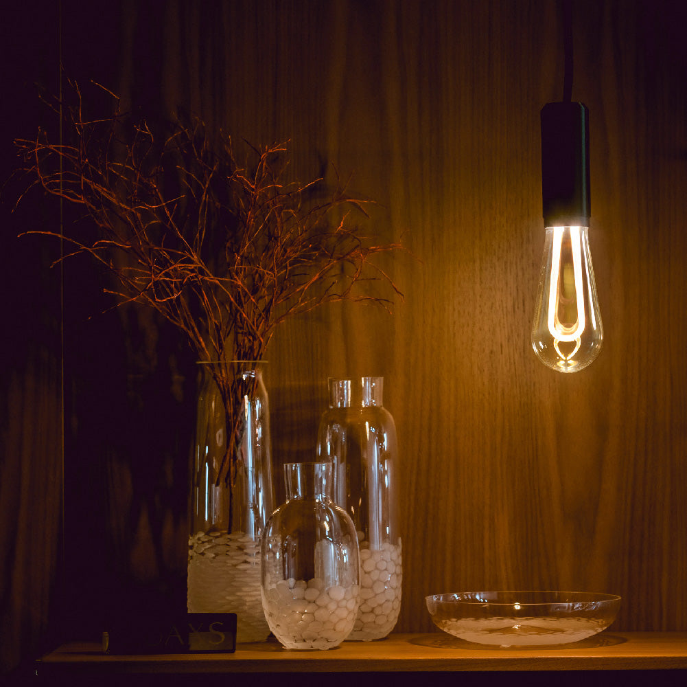 Arc LED light bulb hanging in office