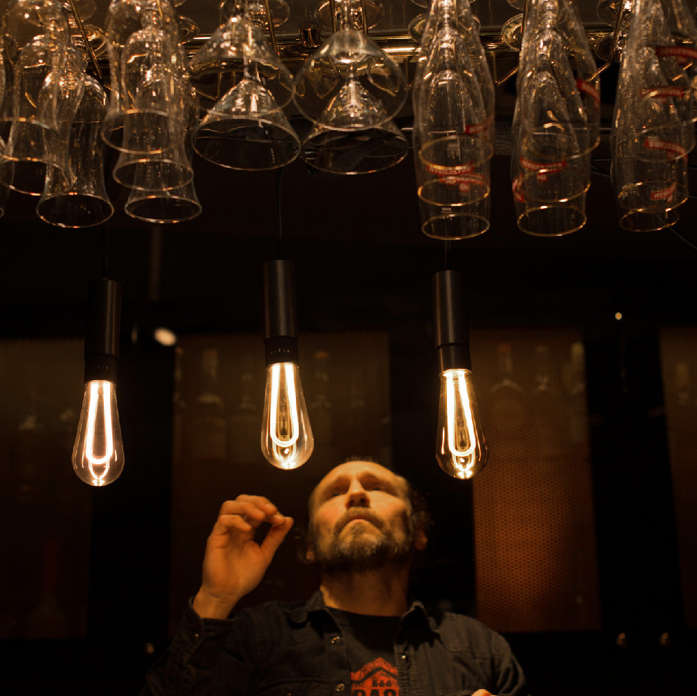 Arc LED light bulb hanging in bar