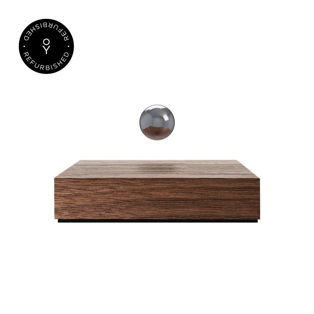 Levitating sphere Buda Ball by Flyte, chrome sphere and walnut magnetic base version, product photo on a white background with refurbished tag
