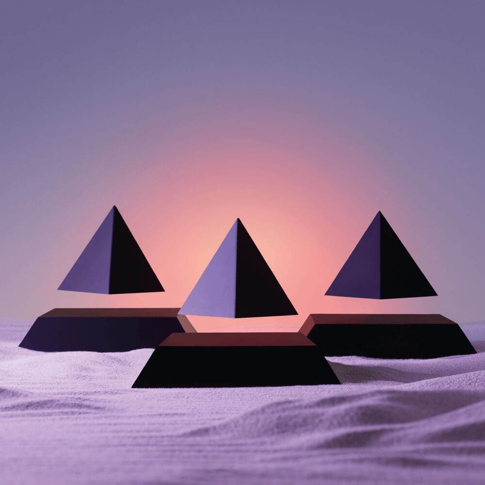 3 levitating pyramids Py by Flyte, black tops on black bases, lifestyle photo on colorfull background