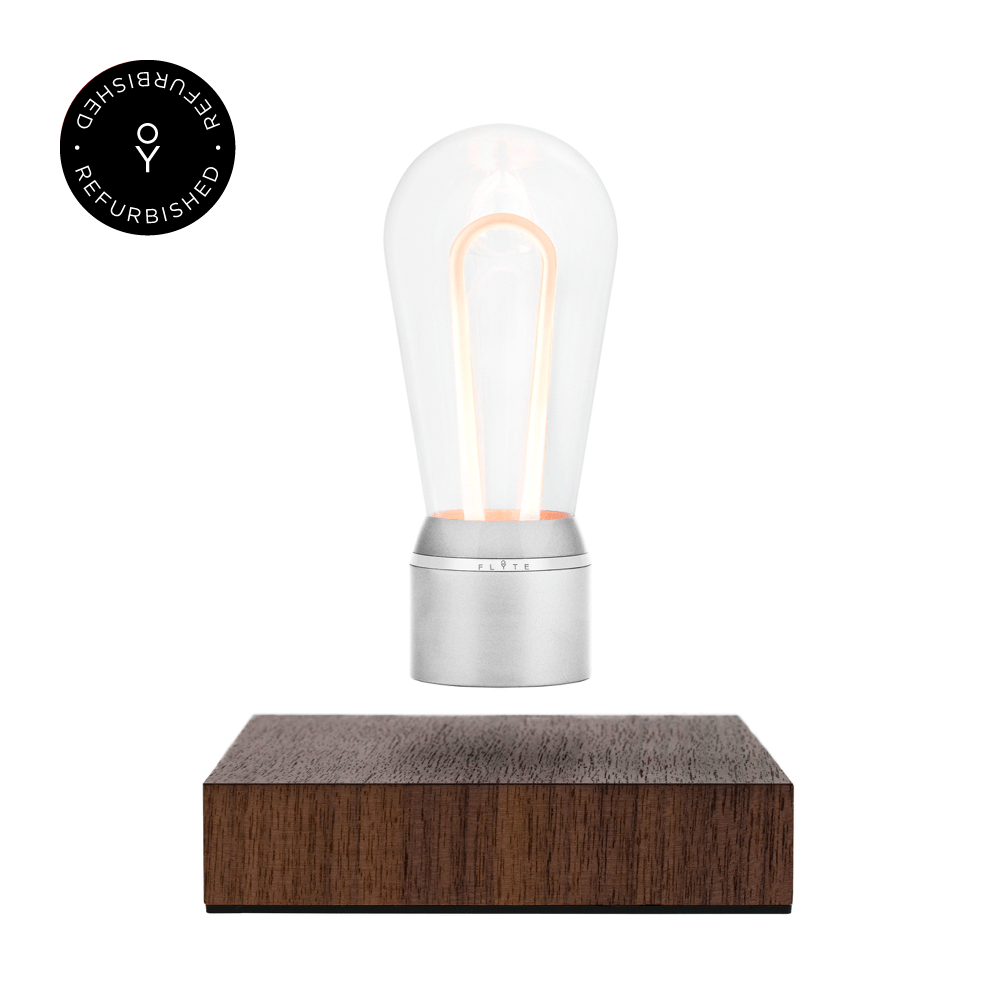 Levitating light bulb Light Marconi by Flyte, product photo of chrome cap bulb and walnut magnetic base version with refurbished tag